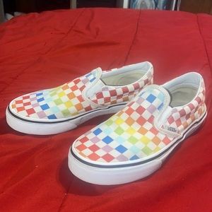 Rainbow slip on checkerboard vans